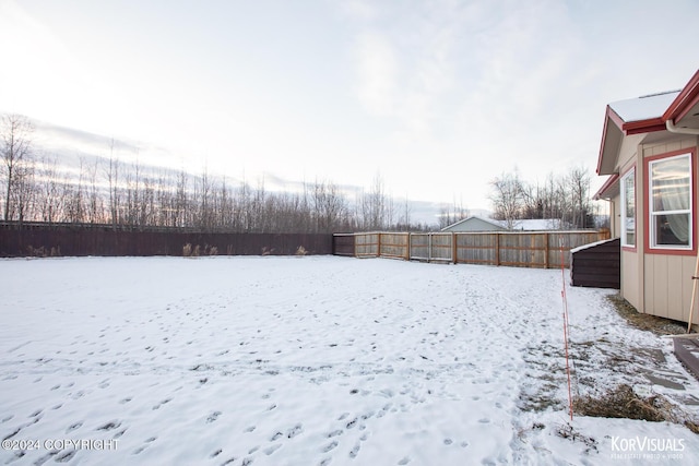 view of yard covered in snow