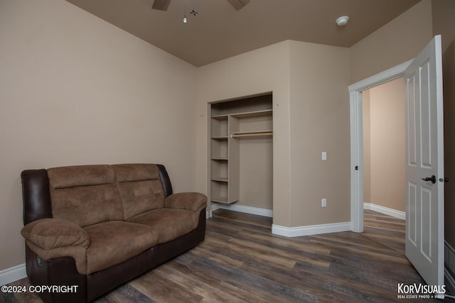 sitting room featuring ceiling fan and dark hardwood / wood-style flooring