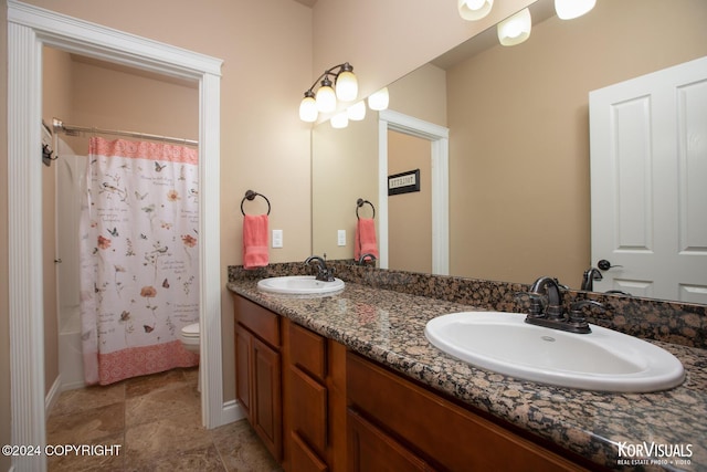 full bathroom featuring toilet, shower / tub combo, and vanity