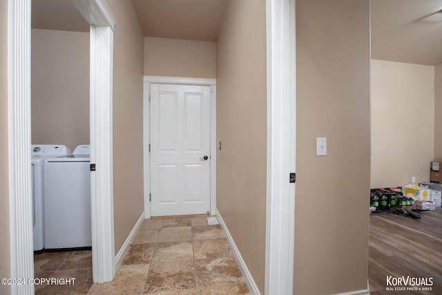 corridor with washer and clothes dryer