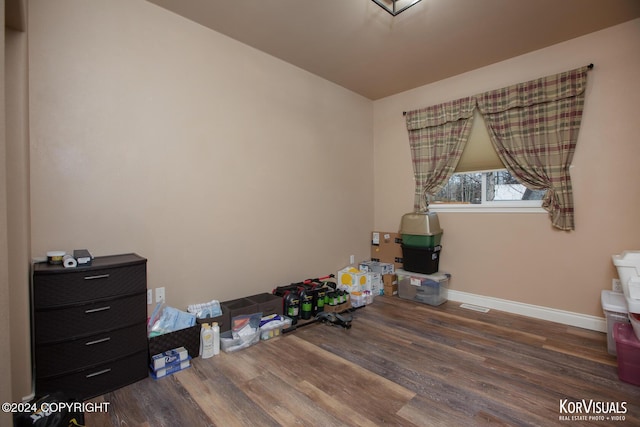 miscellaneous room with dark hardwood / wood-style floors