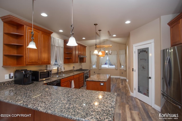 kitchen with a kitchen island, decorative light fixtures, dark stone countertops, and appliances with stainless steel finishes