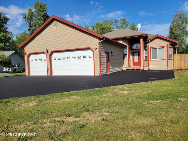 single story home with a front lawn and a garage