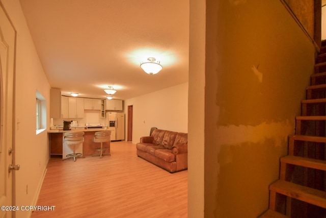 living room with light hardwood / wood-style floors