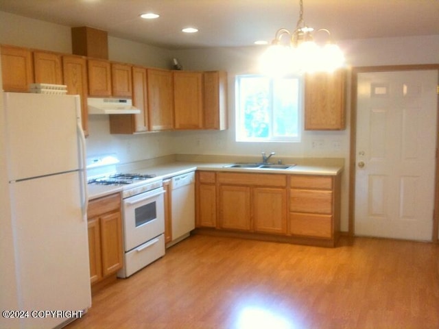 kitchen featuring sink, light hardwood / wood-style floors, white appliances, and a notable chandelier