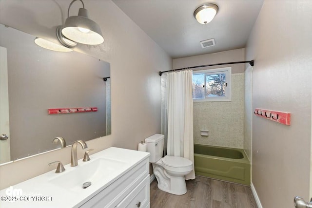 full bathroom with shower / bath combination with curtain, wood-type flooring, toilet, and vanity