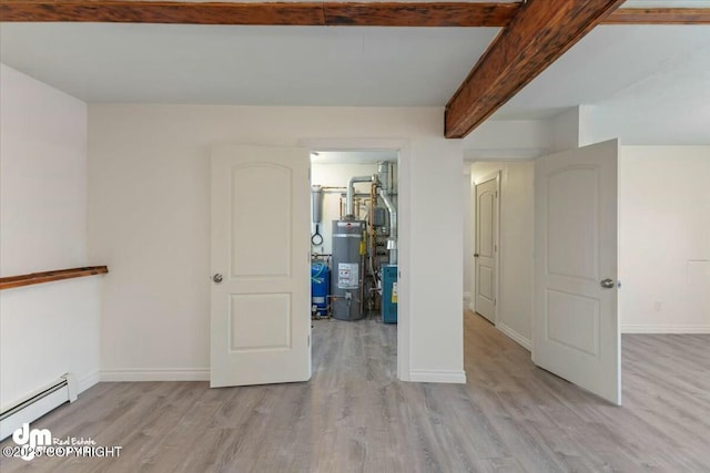 unfurnished bedroom with water heater, a baseboard heating unit, light wood-type flooring, and beamed ceiling