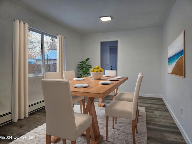 dining space with dark hardwood / wood-style flooring