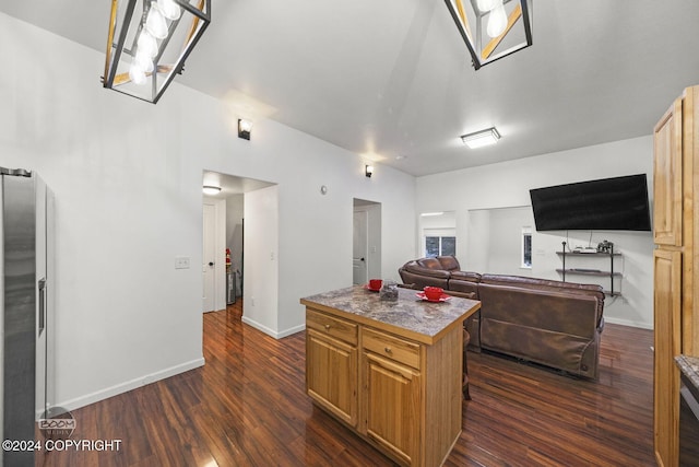 kitchen featuring dark hardwood / wood-style floors and a center island