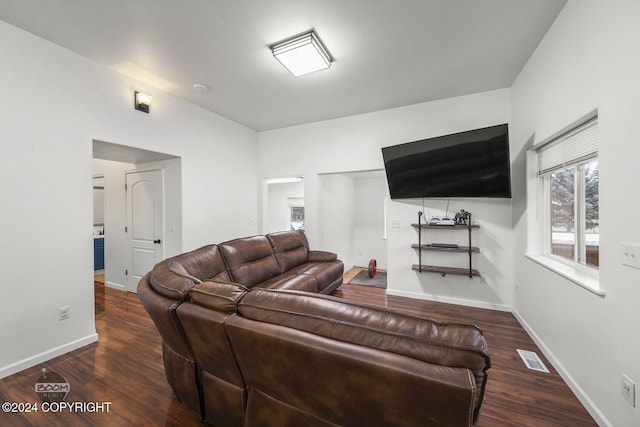 living room with dark hardwood / wood-style flooring