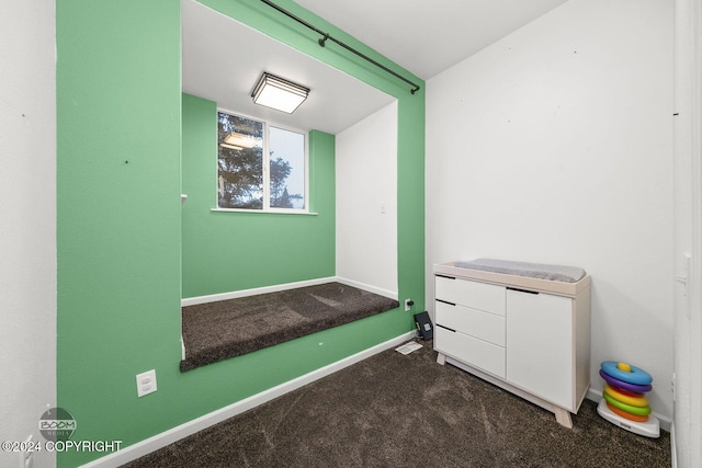 miscellaneous room with carpet flooring