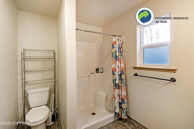 bathroom featuring toilet, tile patterned flooring, and walk in shower