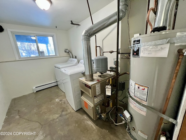 utility room with washing machine and clothes dryer, a baseboard radiator, and water heater