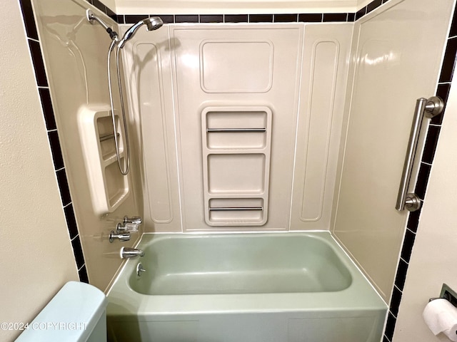 bathroom with toilet and shower / tub combination