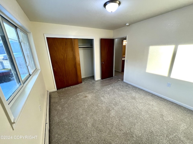 unfurnished bedroom with a closet and carpet