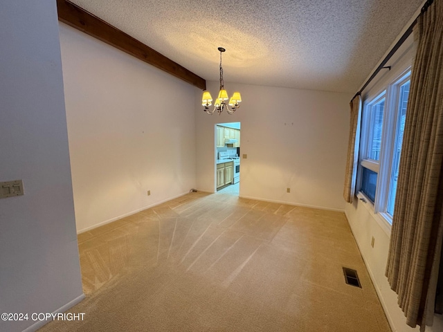 spare room featuring vaulted ceiling with beams, a notable chandelier, visible vents, light carpet, and a textured ceiling