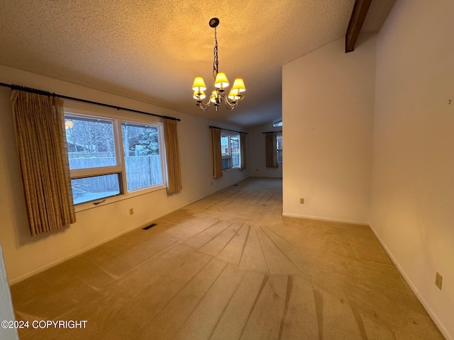 unfurnished dining area with vaulted ceiling with beams, a textured ceiling, visible vents, and carpet flooring