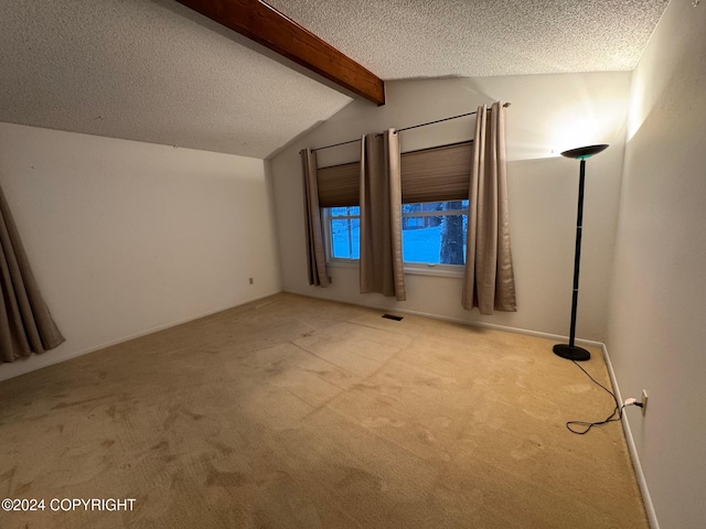 bonus room with vaulted ceiling with beams, visible vents, a textured ceiling, and light colored carpet