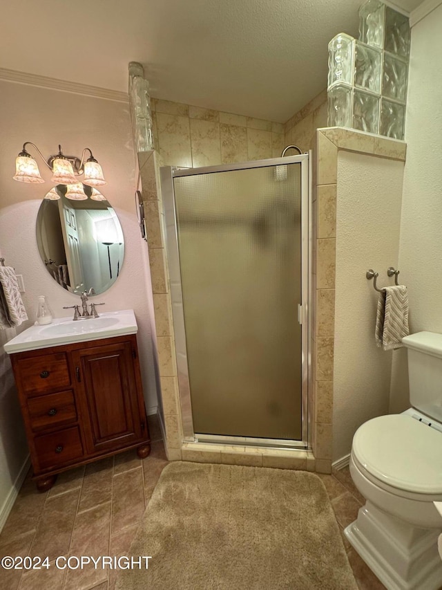 full bathroom with toilet, a shower stall, vanity, and tile patterned floors