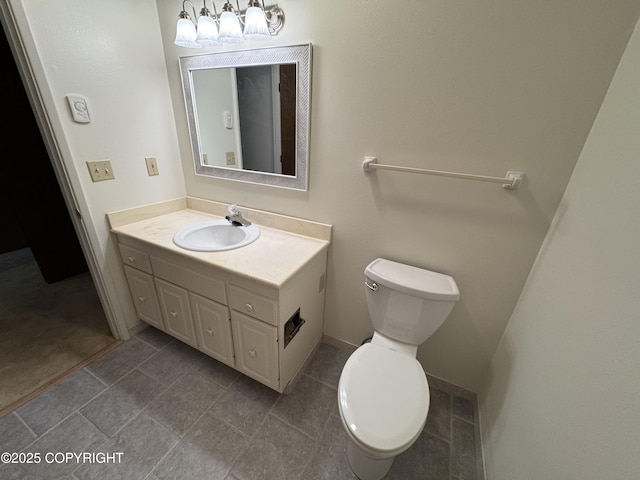 bathroom with toilet and vanity