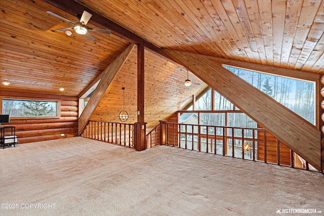 bonus room with ceiling fan, carpet, lofted ceiling with beams, rustic walls, and wooden ceiling