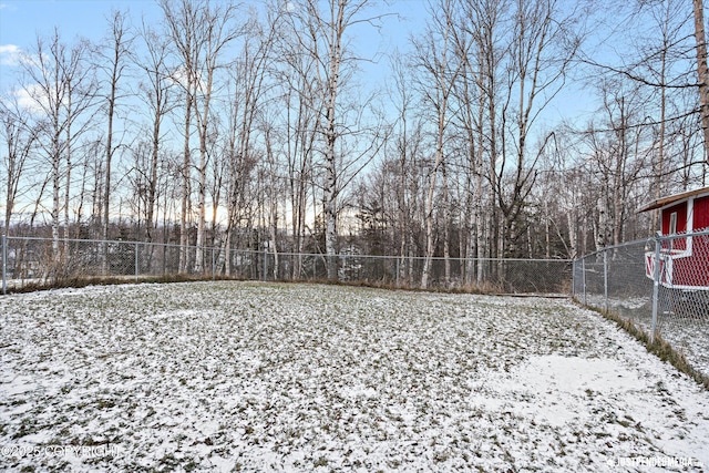 view of yard layered in snow