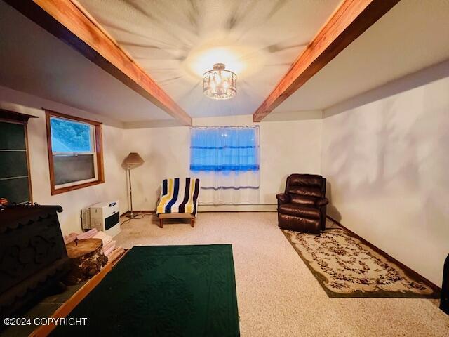 3411 Monashka Bay Rd, Kodiak, AK 99615 - rec room with carpet flooring, beamed ceiling, a chandelier, and a baseboard heating unit