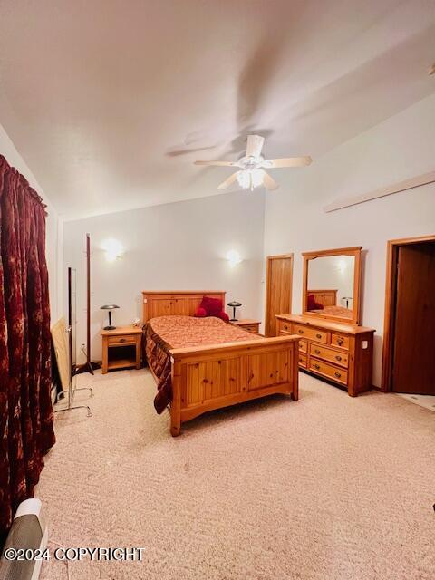 3411 Monashka Bay Rd, Kodiak, AK 99615 - bedroom with lofted ceiling, light carpet, and a ceiling fan