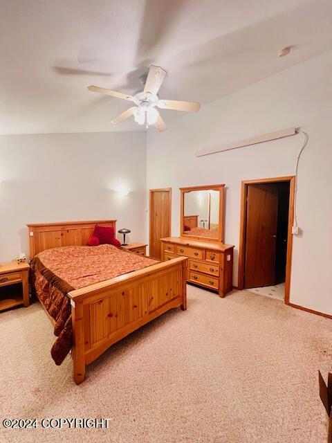 3411 Monashka Bay Rd, Kodiak, AK 99615 - bedroom with light carpet and ceiling fan