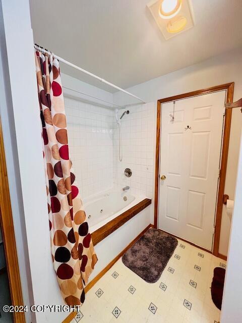 3411 Monashka Bay Rd, Kodiak, AK 99615 - bathroom with shower / bath combination with curtain and tile patterned floors