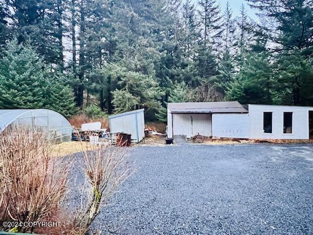 3411 Monashka Bay Rd, Kodiak, AK 99615 - view of yard with an outdoor structure and a greenhouse
