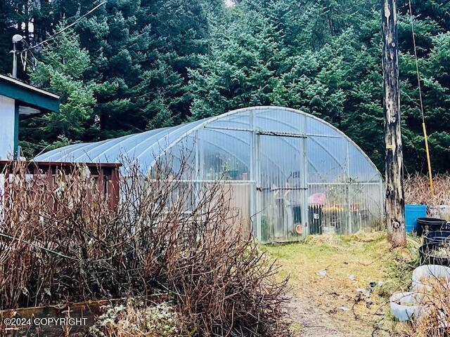 3411 Monashka Bay Rd, Kodiak, AK 99615 - view of greenhouse featuring a forest view