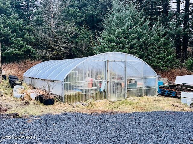 3411 Monashka Bay Rd, Kodiak, AK 99615 - view of greenhouse featuring a view of trees
