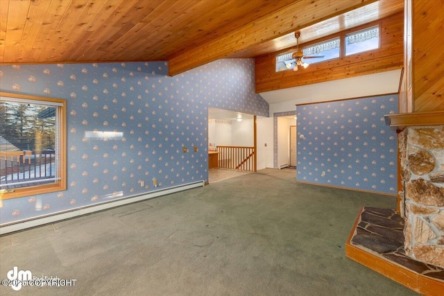 unfurnished living room with ceiling fan, wooden ceiling, vaulted ceiling with beams, a baseboard heating unit, and carpet floors