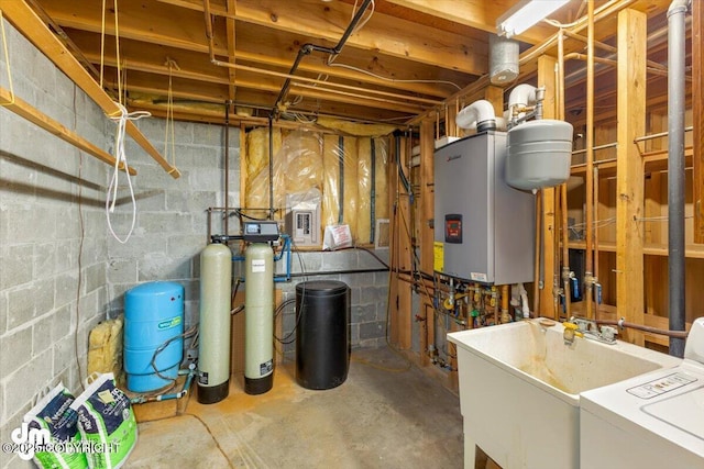 utility room with washer / dryer, tankless water heater, and sink