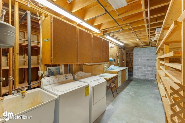 laundry room featuring washer and dryer and sink