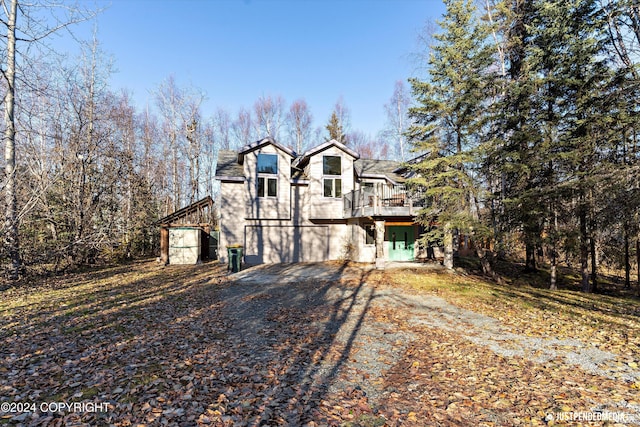 view of front of property with a wooden deck