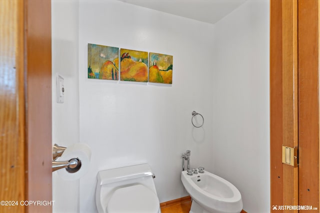 bathroom featuring a bidet and toilet