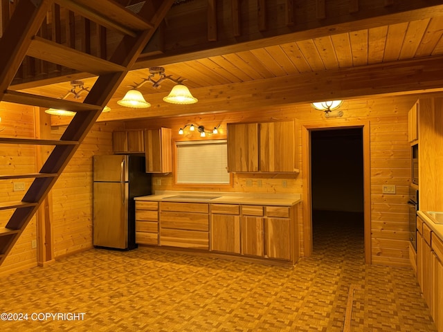 kitchen with wood ceiling, hanging light fixtures, wood walls, and black appliances