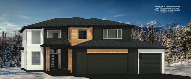 view of front facade featuring a garage and a mountain view