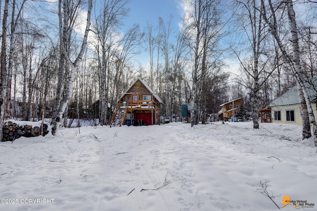 yard layered in snow with a garage