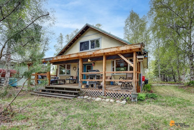 13718 E 1st St, Talkeetna, AK 99676 - rear view of property with a lawn and covered porch