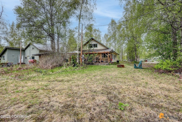 13718 E 1st St, Talkeetna, AK 99676 - view of yard featuring a fire pit