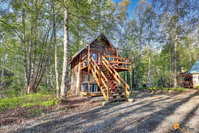 13718 E 1st St, Talkeetna, AK 99676 - view of outbuilding featuring stairway and a wooded view