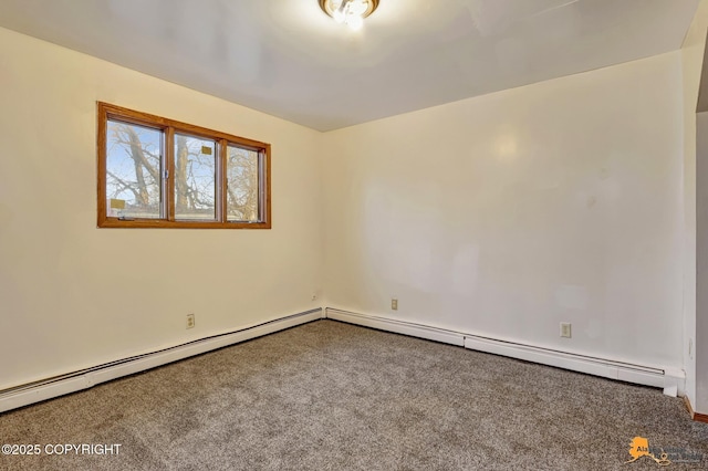 spare room featuring carpet and baseboard heating