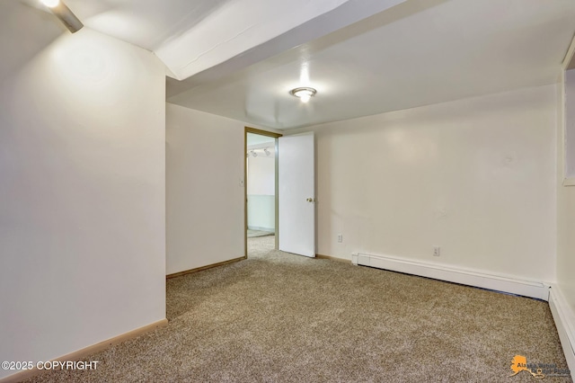 carpeted spare room featuring baseboards and baseboard heating