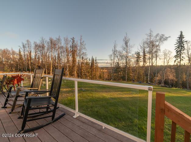 deck at dusk with a yard