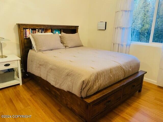 bedroom with light hardwood / wood-style floors