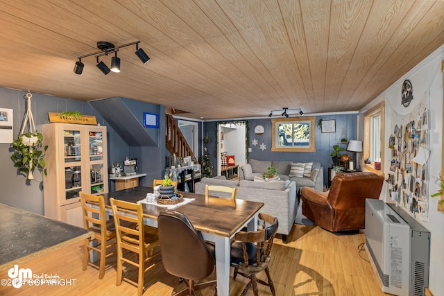 dining area featuring wooden ceiling, light hardwood / wood-style flooring, and track lighting