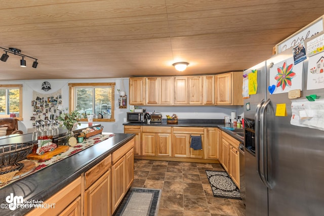 kitchen featuring wooden ceiling, plenty of natural light, rail lighting, and stainless steel appliances